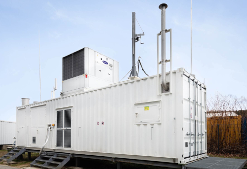 Hydrogen researchers at Graz University of Technology (Austria), together with the Graz-based start-up Rouge H2 Engineering, have developed a cost-effective process for the decentralized production of high-purity hydrogen using chemical looping.  Currently, hydrogen is mainly produced centrally from fossil resources and compressed or liquefied in an expensive and energy-intensive process in order to be able to supply it to filling stations. Additionally, expensive infrastructure with high investment costs is needed there to store large quantities of hydrogen.  The Fuel Cells and Hydrogen Systems Working Group at TU Graz’s Institute of Chemical Engineering and Environmental Technology has been looking for ways to make hydrogen production more attractive. As part of the HyStORM (Hydrogen Storage via Oxidation and Reduction of Metals) research project, the team led by working group head Viktor Hacker developed a chemical-looping hydrogen method for decentralized and climate-neutral hydrogen production.  The research resulted in a compact and space-saving on-site, on-demand (OSOD) system for filling stations and energy plants and is being developed and distributed by the Graz-based start-up Rouge H2 Engineering.  The OSOD system is a hydrogen generator with integrated storage device in one system. Hydrogen is produced by converting biogas, biomass or natural gas into a syngas. The provided energy is then stored by means of a redox process (reduction-oxidation process) in a metal oxide, which can be stored and transported without any losses or safety risks.  OSOD H2 generator. The blue cuboid is the core development: a gas furnace with four tubular reactors in which the chemical looping process for hydrogen production takes place. ? RGH2  The subsequent demand-oriented production of hydrogen is achieved by feeding water into the system. The iron-based material is charged with steam and high-purity hydrogen is released.  This process also makes the system interesting for smaller applications.  For this reason, the OSOD system is freely scalable and is particularly suitable for decentralized applications with low feed-in rates in laboratories and smaller industrial systems as well as larger decentralized units such as hydrogen filling stations or hydrogen production from biogas.  In addition to the provision of high purity hydrogen, Gernot Voitic, lead project manager of R&D at Rouge H2 Engineering, points out that the OSOD system can switch to standby mode in the case of low demand and resume hydrogen production at any time if required.  Rouge H2 Engineering and TU Graz researchers are already focusing on the next step. At present, the system is still operated on an industrial scale with natural gas. The working group now wants to make it usable for biogas, biomass and other regionally available raw materials. Biogas plants, for example, could thus become even more competitive in the future and, instead of electricity, also produce green hydrogen, which could be used for sustainable mobility concepts.  The HyStORM research project is anchored in the Field of Expertise “Mobility & Production” at TU Graz, one of the five strategic research foci of the university.  Resources  Bock, S., Zacharias, R., Schauperl, R., Voitic, G., & Hacker, V. (2020). “Decentralized hydrogen generation and energy storage from biomass and biogas with Fixed-Bed Chemical Looping.” In 6th Central European Biomass Conference CEBC 2020, Proceedings (pp. 59). Graz.  Robert Zacharias, Simone Visentin, Sebastian Bock, Viktor Hacker (2019) “High-pressure hydrogen production with inherent sequestration of a pure carbon dioxide stream via fixed bed chemical looping,” International Journal of Hydrogen Energy, Volume 44, Issue 16, pages 7943-7957 doi: 10.1016/j.ijhydene.2019.01.257 (open access)